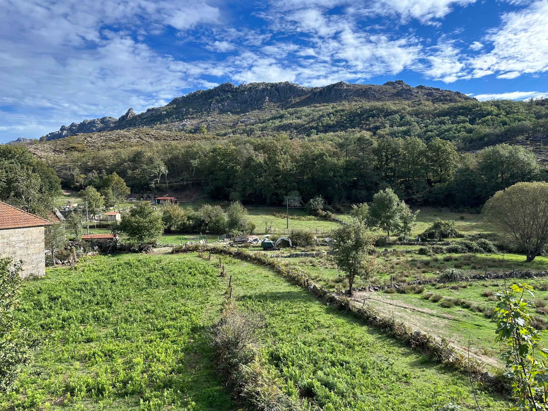 Green terraced fields below the granite peaks near Ameijoeira, Peneda-Gerês